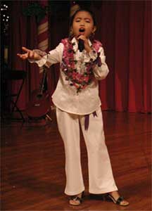 A Voicemaster student performing on stage